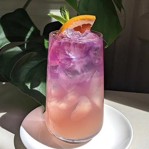 Infusion mocktail pink and peach in a tall glass
