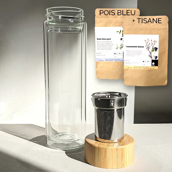 Glass infuser with one packet of the product Pure Butterfly Pea and one butterfly pea tisane